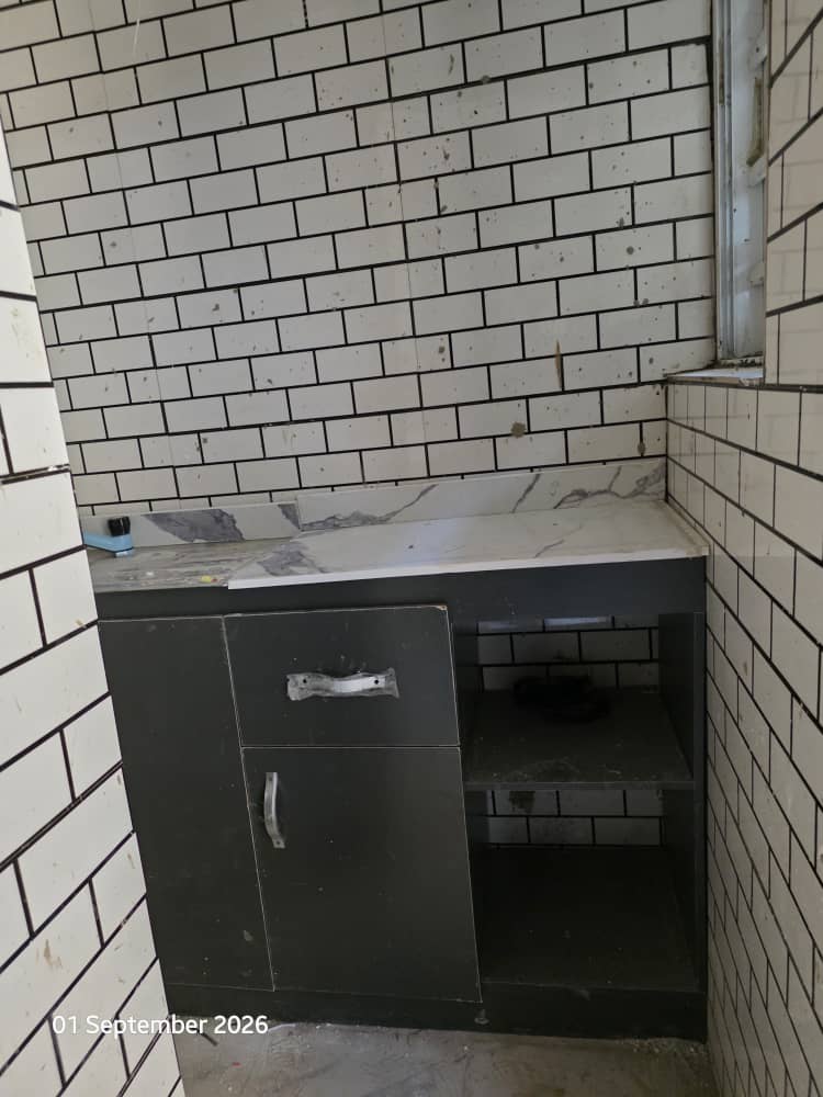Kitchen cabinet and storage area at Achievers Dorms